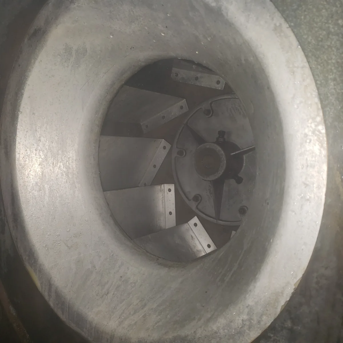 Close-up of commercial kitchen exhaust equipment and cleaning preparation