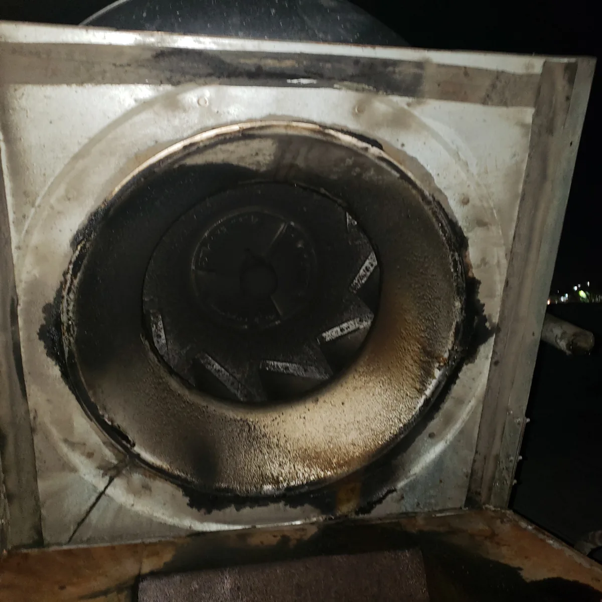 Close-up of commercial kitchen exhaust equipment and cleaning preparation